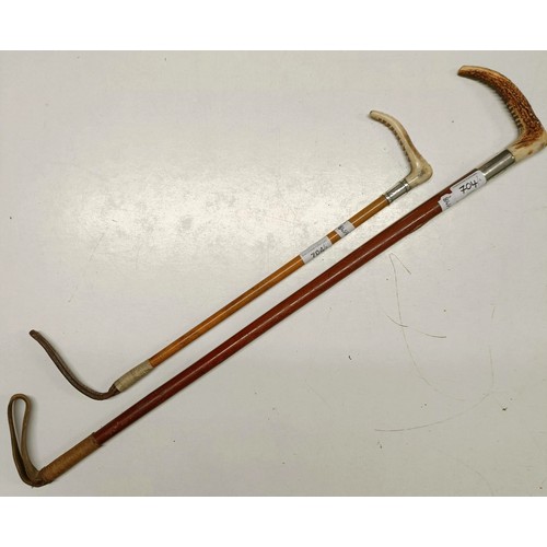 1141 - A riding crop, with a silver mount, and another (2)