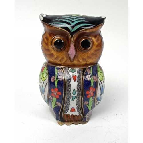 1013 - A Chinese pottery figure, 62 cm high, a cloisonné owl, on a stand, a seal and an oval dish (4...