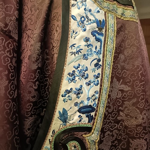 989 - A vintage Chinese robe, collar and sleeves embroidered blue and white flowers, and exotic birds