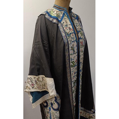 992 - A vintage Chinese robe, collar and sleeves embroidered figures in a landscape