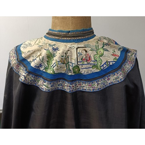 992 - A vintage Chinese robe, collar and sleeves embroidered figures in a landscape