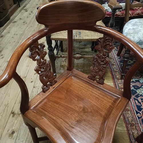 884 - A pair of Chinese hardwood corner chairs (2)