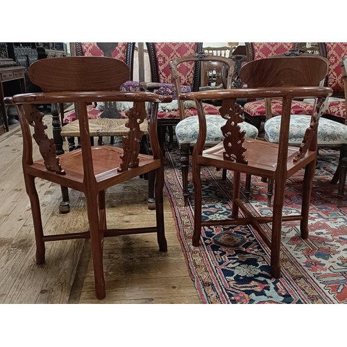 884 - A pair of Chinese hardwood corner chairs (2)