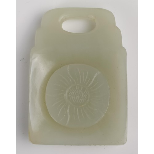 1005 - A Chinese carved pale green stone plaque, 6 x 5 cm