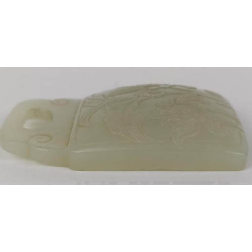 1005 - A Chinese carved pale green stone plaque, 6 x 5 cm