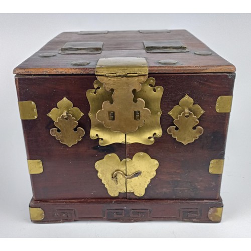 1009 - A Chinese hardwood and metal bound dressing chest, 23 cm wide