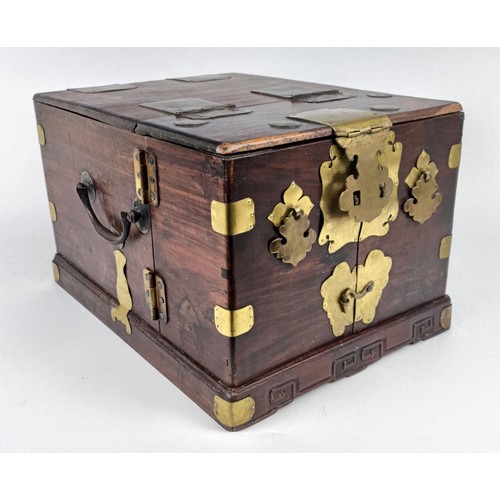 1009 - A Chinese hardwood and metal bound dressing chest, 23 cm wide