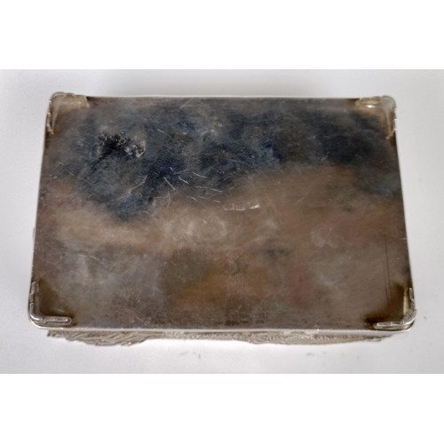 1010 - A Chinese silver coloured metal rectangular box, decorated a dragon, 12 cm wide...