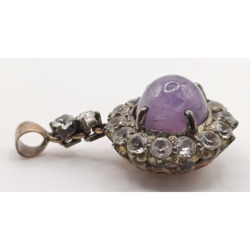 650 - An amethyst and white stone pendant