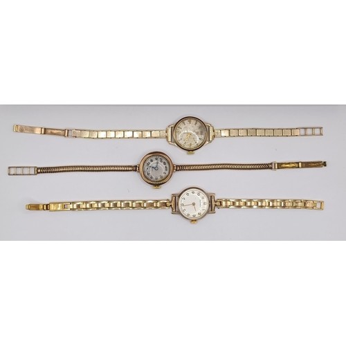 651 - A ladies 9ct gold wristwatch, on a gold plated strap, two other ladies wristwatches, and a vintage w... 