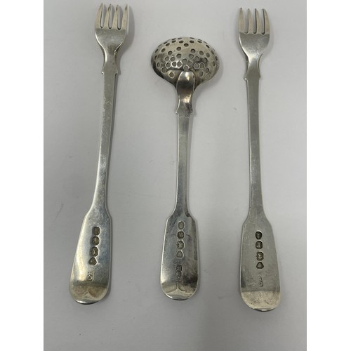 210 - A George III silver fiddle pattern sifter spoon and two pickle forks, 1.5 ozt (3)