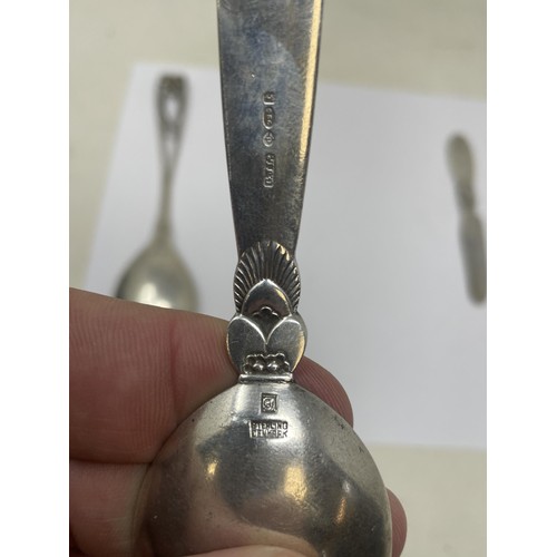 208 - A Georg Jensen spoon, and three other items of Georg Jensen cutlery, 130 g (4)