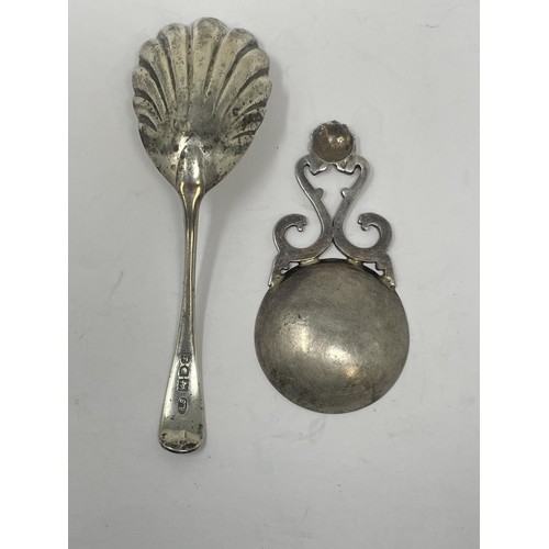 202 - A George V silver caddy spoon, London 1923, and another (2)