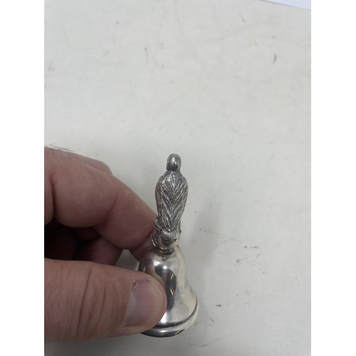 190 - A Portuguese silver coloured metal bell, with a bird finial, 96 g