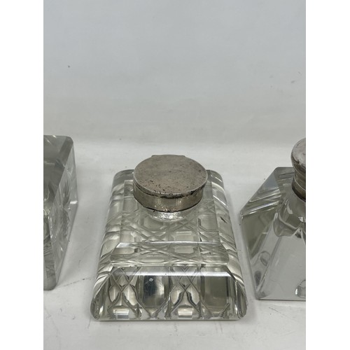 180 - A cut glass inkwell, with silver mounts, and four others (5)