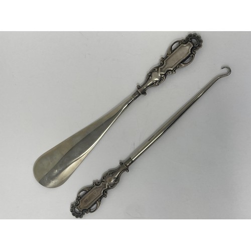 177 - A shoehorn and matching button hook, with silver mounts, cased, and a set of six coffee spoons, case... 