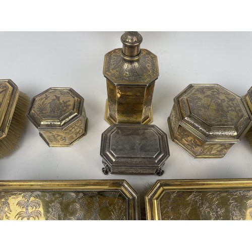 173 - An 18th century style silver gilt dressing table set, with chinoiserie style decoration, comprising ... 