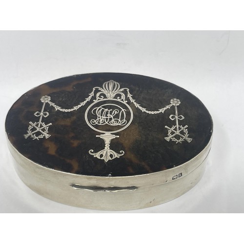 166 - An Edward VII oval silver and tortoiseshell dressing table box, London 1906, 11 cm wide