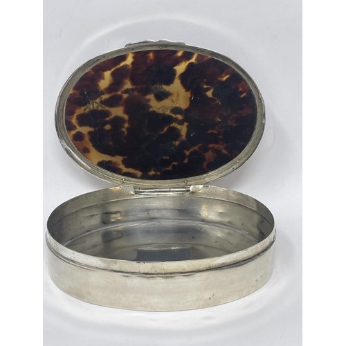 166 - An Edward VII oval silver and tortoiseshell dressing table box, London 1906, 11 cm wide