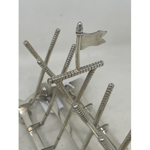 161 - A Victorian silver plated novelty toast rack, in the form of golf clubs and balls, 16 cm wide