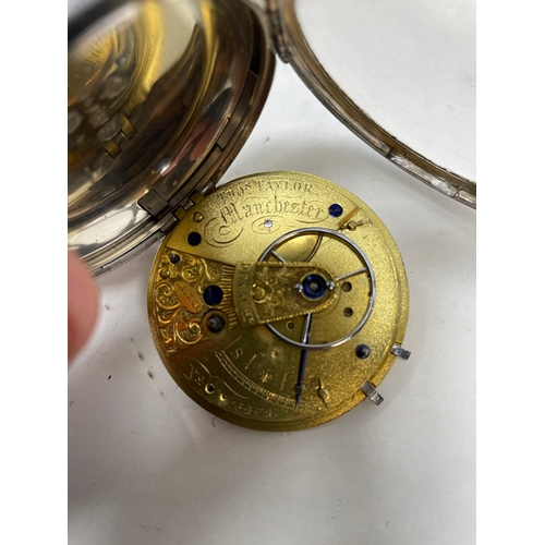 653 - A silver open face pocket watch, the movement signed Tho. Taylor Manchester...