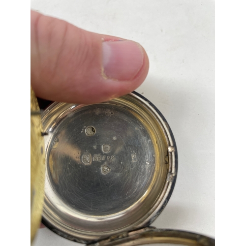 653 - A silver open face pocket watch, the movement signed Tho. Taylor Manchester...