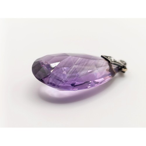 410 - An amethyst and diamond pendant