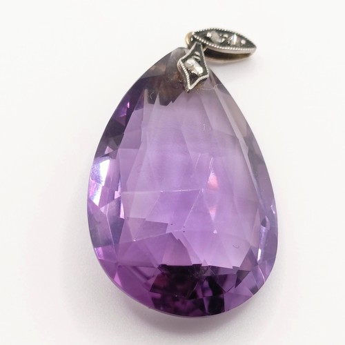 410 - An amethyst and diamond pendant