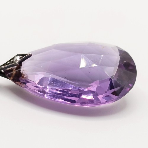 410 - An amethyst and diamond pendant