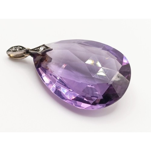 410 - An amethyst and diamond pendant