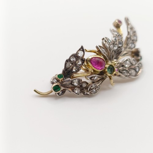 419 - A diamond and multi-coloured gem floral brooch, decorated an insect