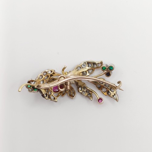 419 - A diamond and multi-coloured gem floral brooch, decorated an insect