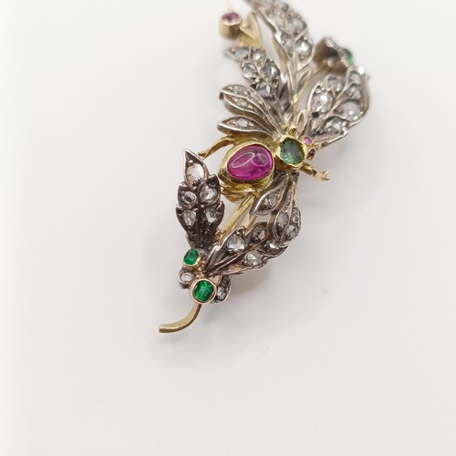 419 - A diamond and multi-coloured gem floral brooch, decorated an insect