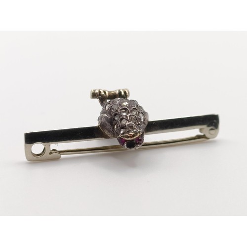 430 - A diamond and red stone bird bar brooch