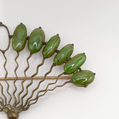 475 - An antique silver ring, and a yellow metal and green stone fan brooch, lacking two stones (2)