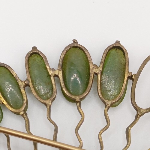 475 - An antique silver ring, and a yellow metal and green stone fan brooch, lacking two stones (2)