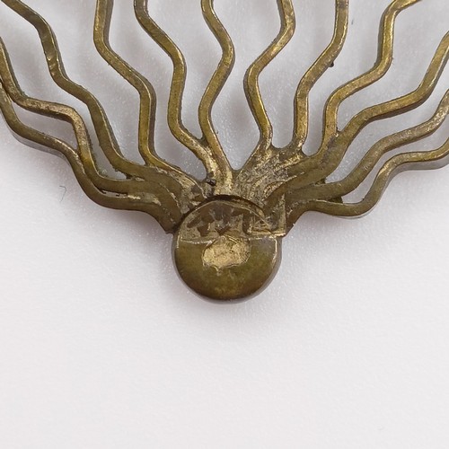 475 - An antique silver ring, and a yellow metal and green stone fan brooch, lacking two stones (2)