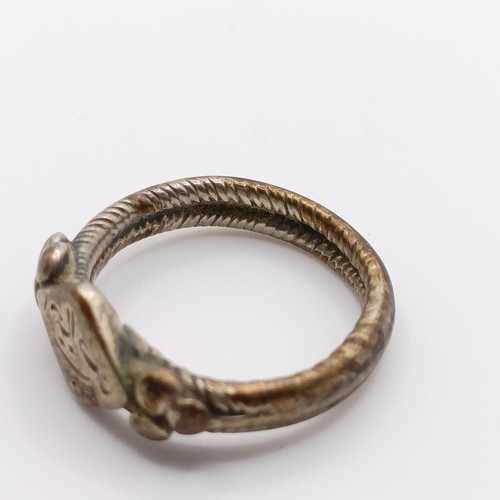 475 - An antique silver ring, and a yellow metal and green stone fan brooch, lacking two stones (2)