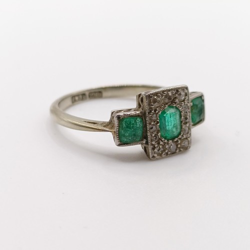 471 - An 18ct gold, platinum, emerald and diamond ring, ring size K