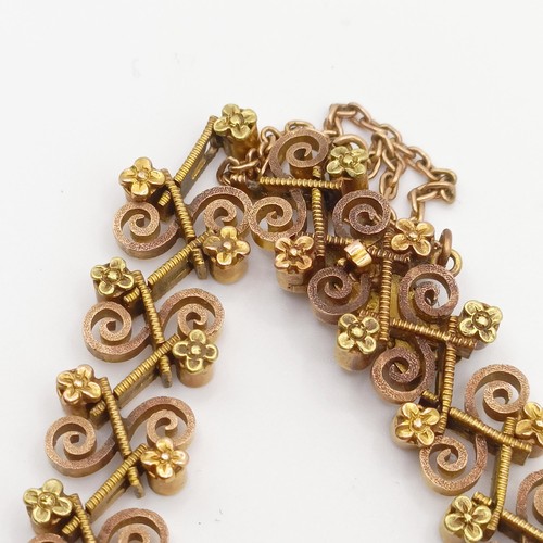 476 - An early 20th century multi-coloured yellow coloured metal fancy bracelet, testing as high carat gol... 