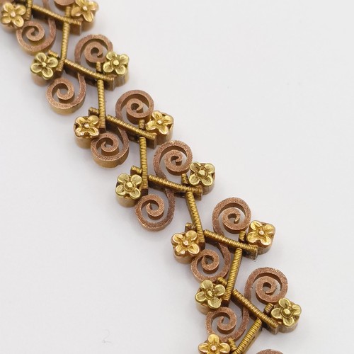 476 - An early 20th century multi-coloured yellow coloured metal fancy bracelet, testing as high carat gol... 