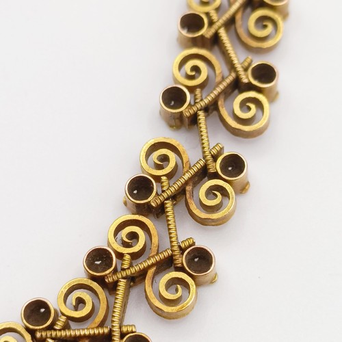 476 - An early 20th century multi-coloured yellow coloured metal fancy bracelet, testing as high carat gol... 