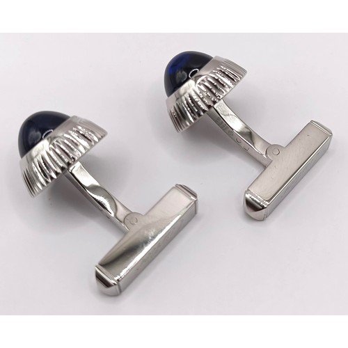 623 - A pair of Cartier silver coloured metal and blue glass cufflinks, boxed