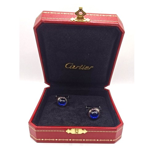 623 - A pair of Cartier silver coloured metal and blue glass cufflinks, boxed