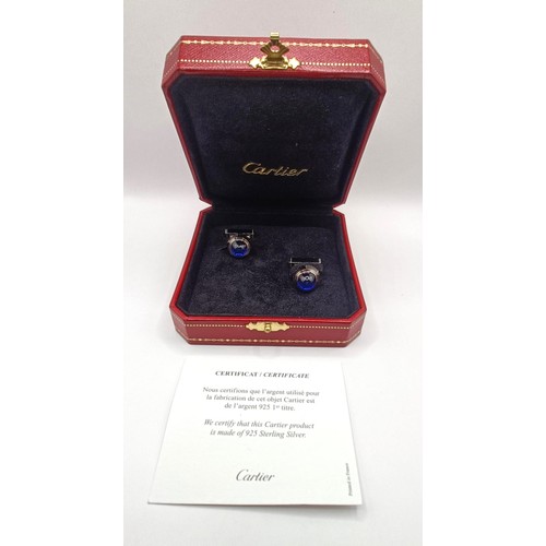 623 - A pair of Cartier silver coloured metal and blue glass cufflinks, boxed