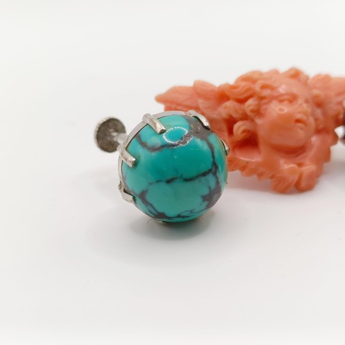 453 - A carved coral brooch, a turquoise and silver ring, ring size M, and a pair of turquoise stud earrin... 