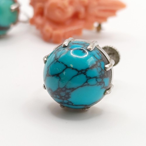 453 - A carved coral brooch, a turquoise and silver ring, ring size M, and a pair of turquoise stud earrin... 