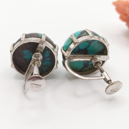 453 - A carved coral brooch, a turquoise and silver ring, ring size M, and a pair of turquoise stud earrin... 