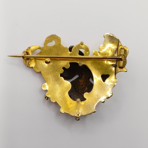 468 - An early 20th century yellow coloured metal, garnet and seed pearl brooch