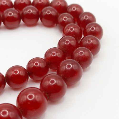 470 - A red amber bead necklace, 24.1 g